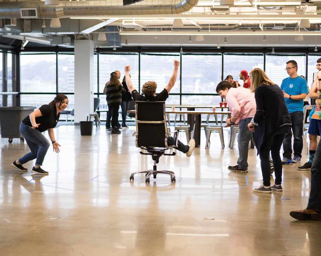 people in an office having fun