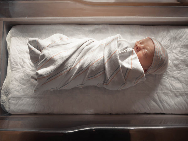 Baby in hospital bassinet