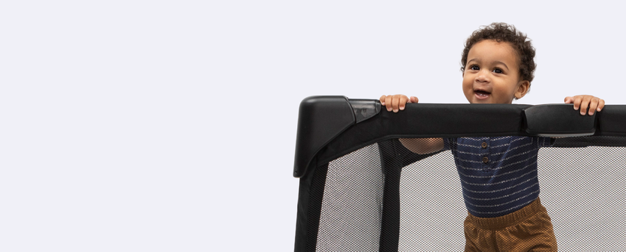 Baby in 4moms playard 